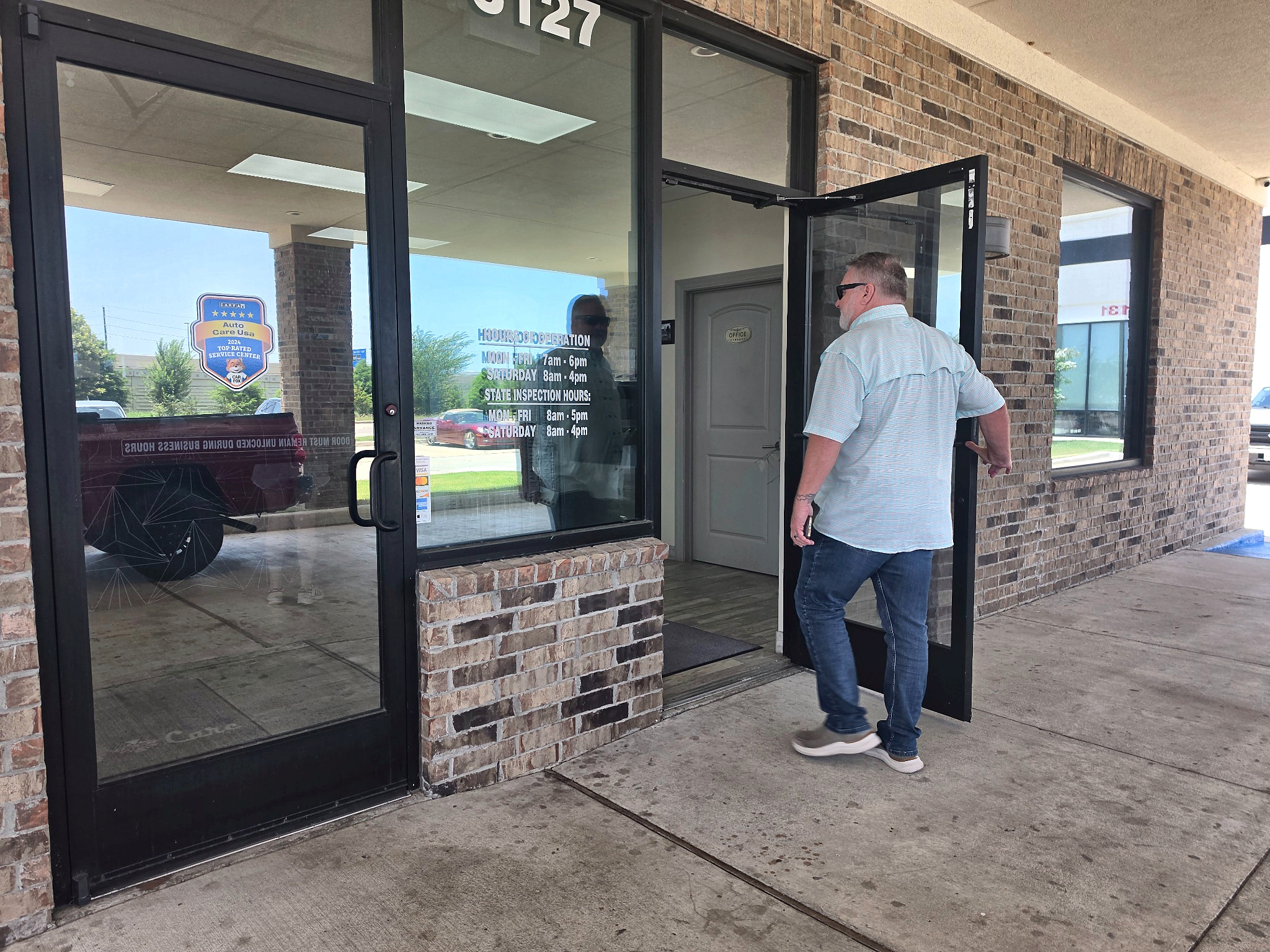 Customer entrance at Auto Care USA auto repair in Katy, TX