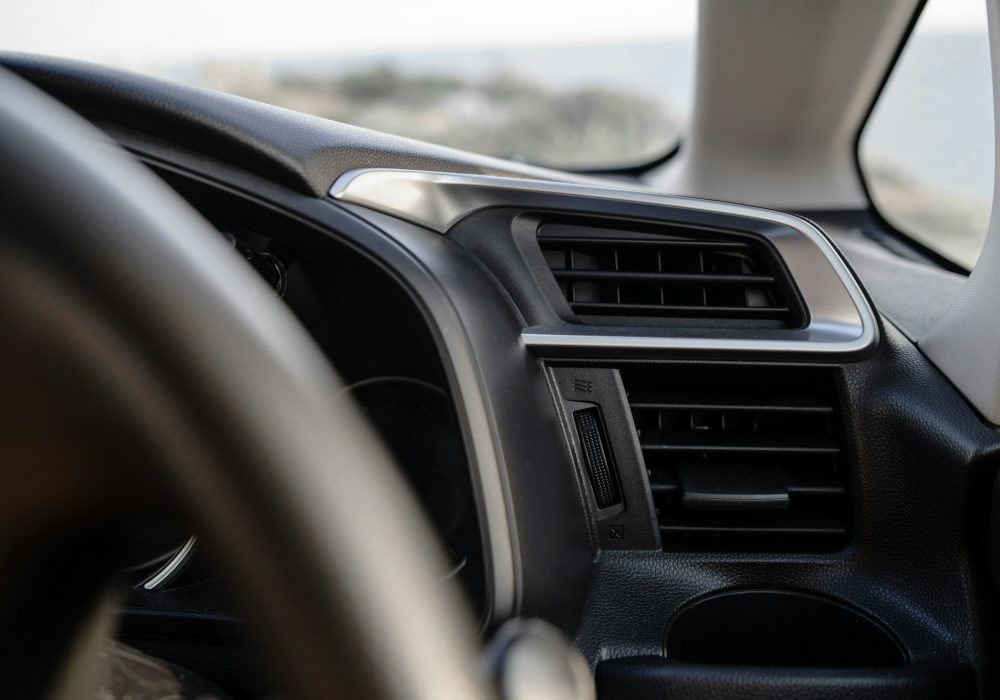 Closeup view of air vent inside modern car dashboard